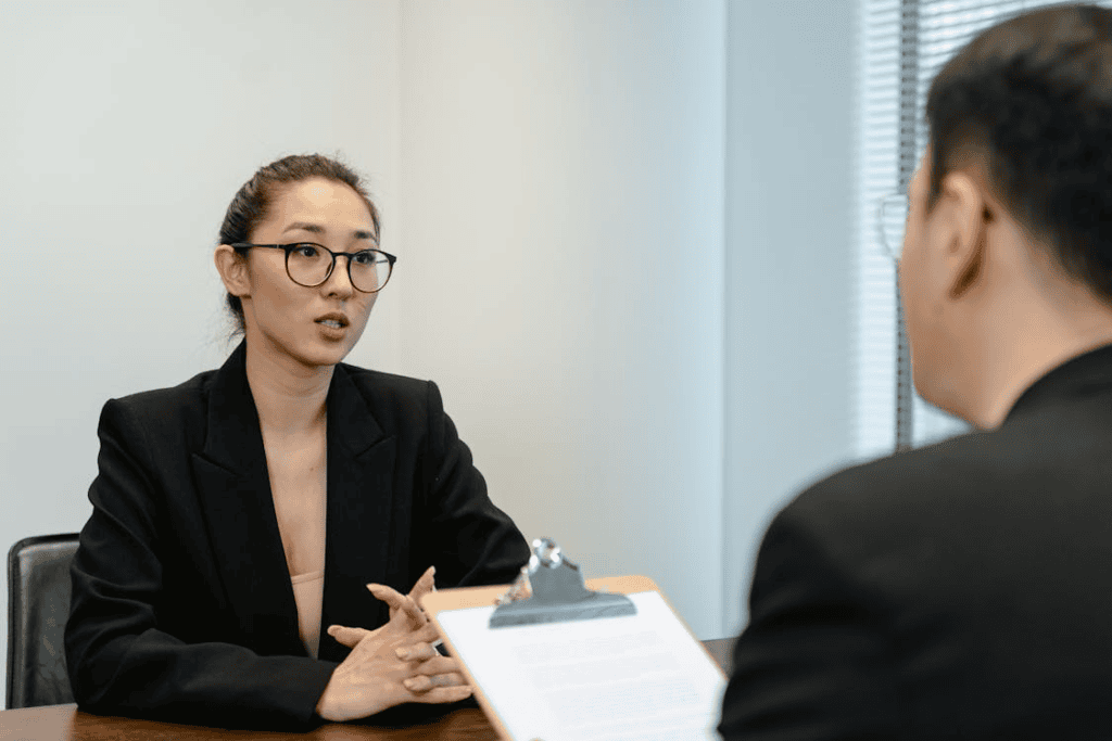 a woman in business attire getting a job interview